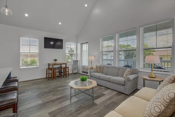 a view of a livingroom with furniture and a window