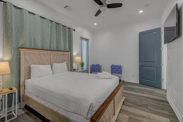 a bedroom with a bed and a lamp