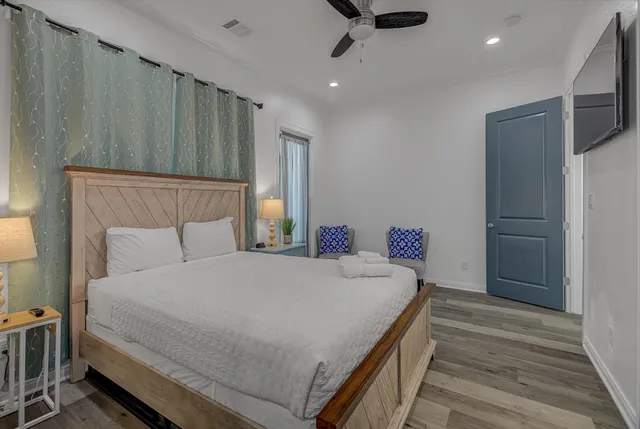 a bedroom with a bed and a lamp