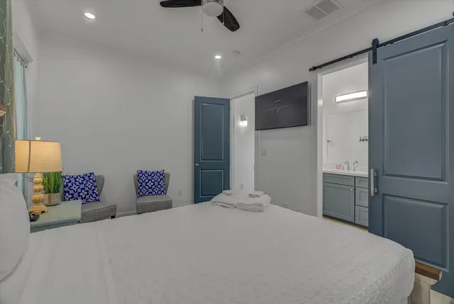 a bathroom with a sink toilet a mirror and shower