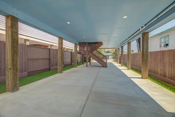 a view of a house with a yard and sitting area