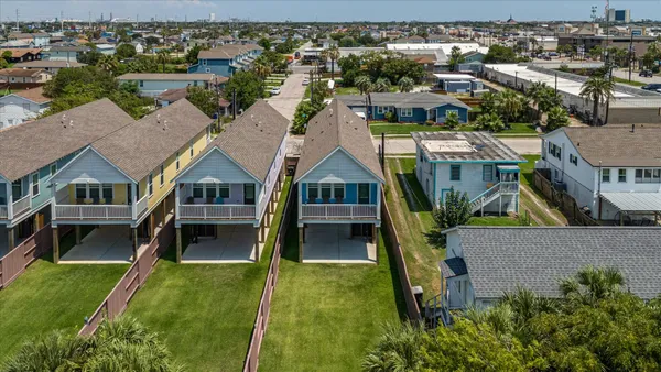 an aerial view of residential building and lake