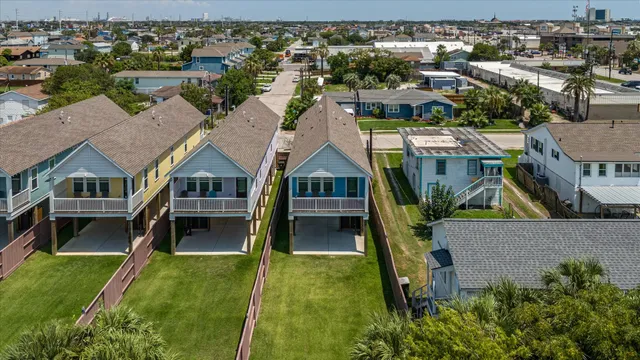 an aerial view of residential building and lake