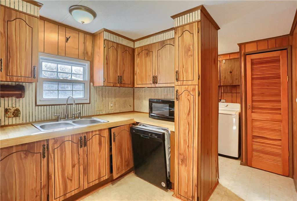 5035 Bear Run Road Cranberry Township, PA 16066 - Photo 12 of 47 a kitchen with a sink and a refrigerator