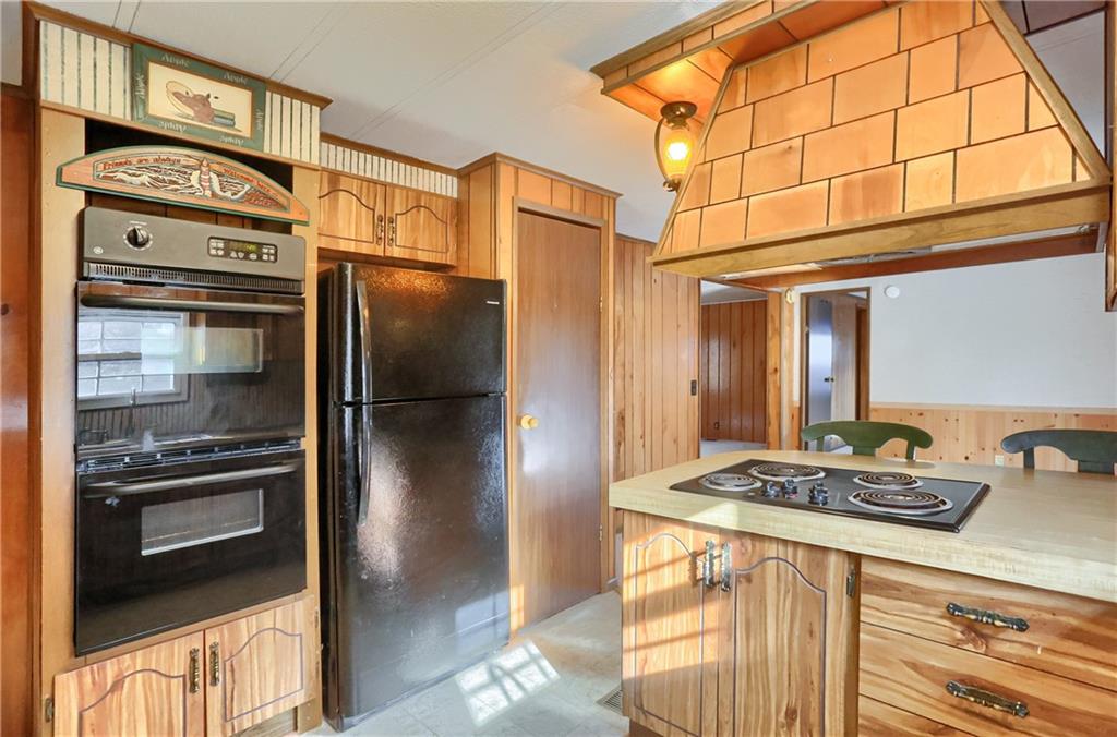 5035 Bear Run Road Cranberry Township, PA 16066 - Photo 14 of 47 a kitchen with stainless steel appliances granite countertop a refrigerator and a stove top oven