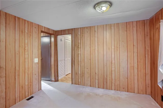 a view of a room with a wooden walls