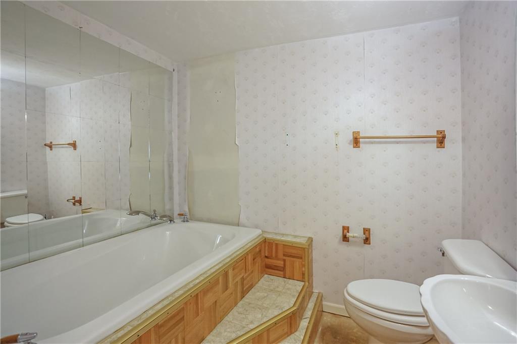 5035 Bear Run Road Cranberry Township, PA 16066 - Photo 17 of 47 a bathroom with a sink a toilet and a mirror