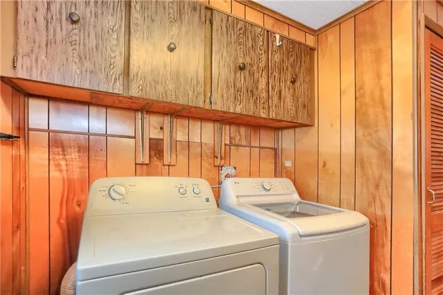 a bathroom with a sink mirror vanity and toilet