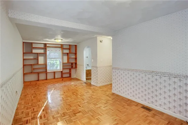 a bathroom with a toilet a sink and a mirror