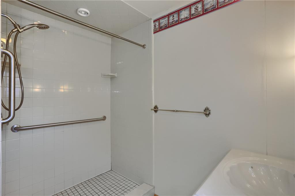 5035 Bear Run Road Cranberry Township, PA 16066 - Photo 29 of 47 a bathroom with a glass shower door