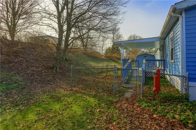 a view of a brick house with a large window