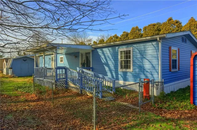 a view of a two chairs in the balcony