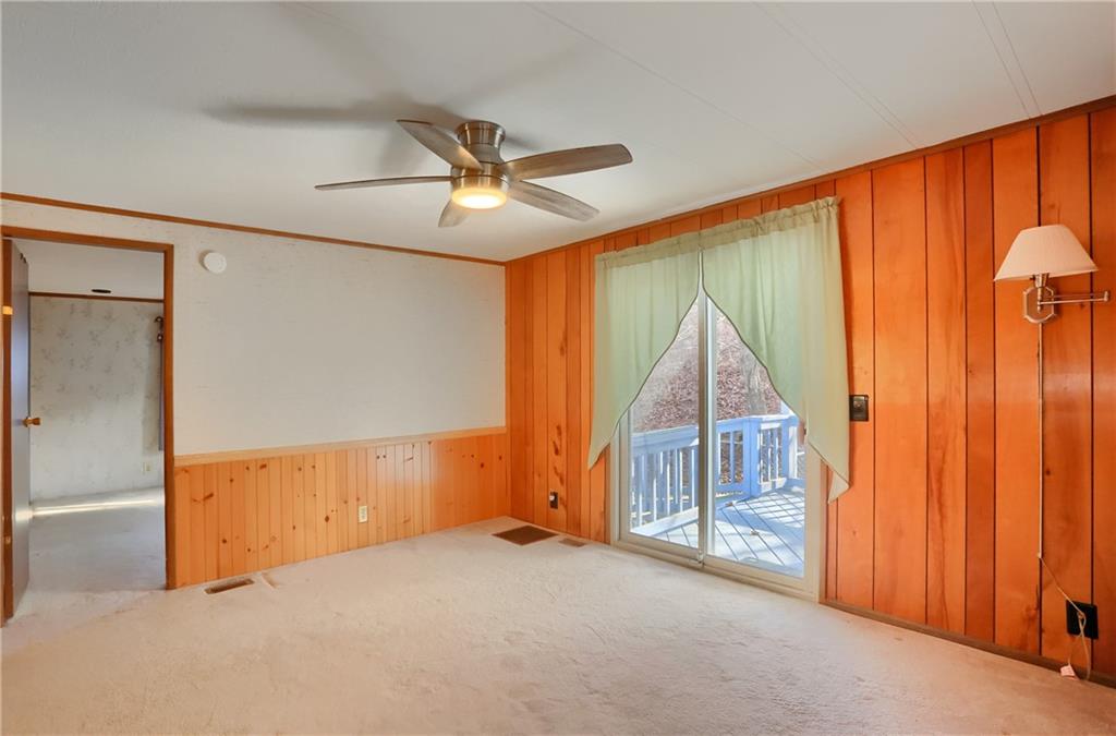 5035 Bear Run Road Cranberry Township, PA 16066 - Photo 7 of 47 an empty room with windows and cabinet
