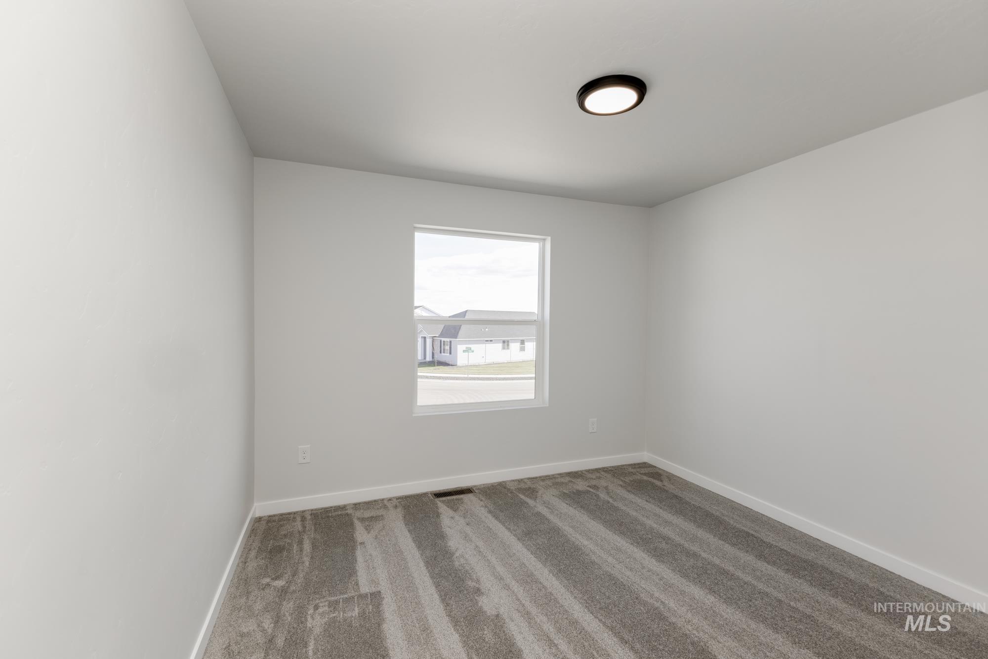 1107 Webb Brk Street Middleton, ID 83644 - Photo 16 of 23 Carpeted spare room featuring baseboards