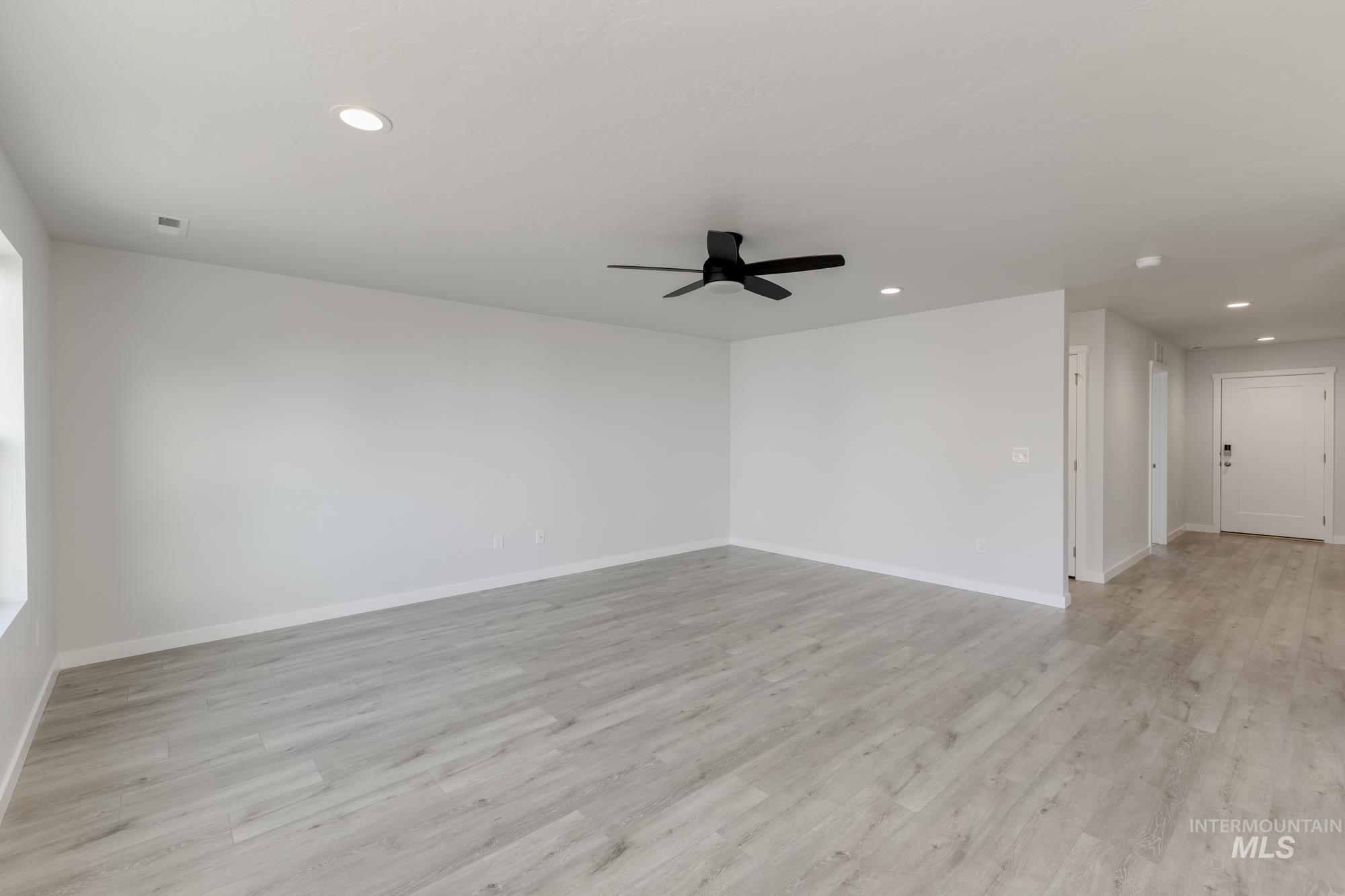 1107 Webb Brk Street Middleton, ID 83644 - Photo 9 of 23 Spare room with recessed lighting, light wood-type flooring, and a ceiling fan