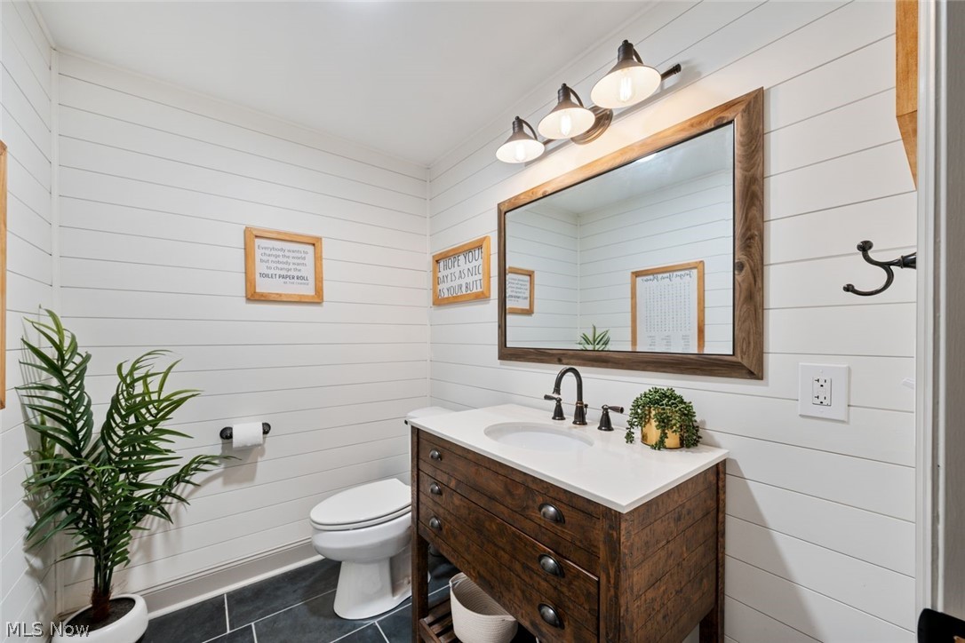 6517 Stone Road Medina, OH 44256 - Photo 34 of 47 Basement Bathroom with vanity, toilet, and tile patterned flooring