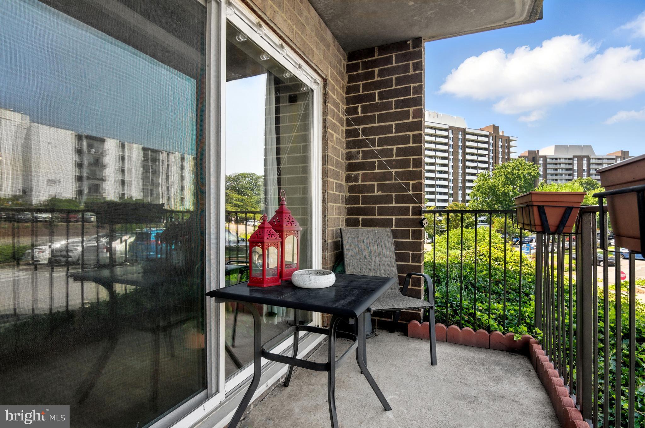 75 South Reynolds Street, Unit 101 Alexandria, VA 22304 - Photo 14 of 38 a view of a balcony with chairs