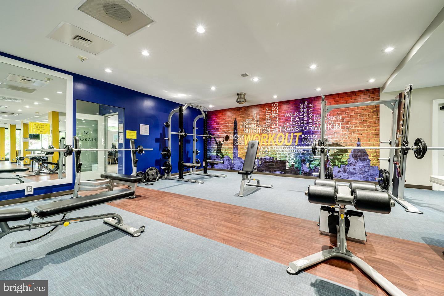 75 South Reynolds Street, Unit 101 Alexandria, VA 22304 - Photo 15 of 38 a room with gym equipment and a table