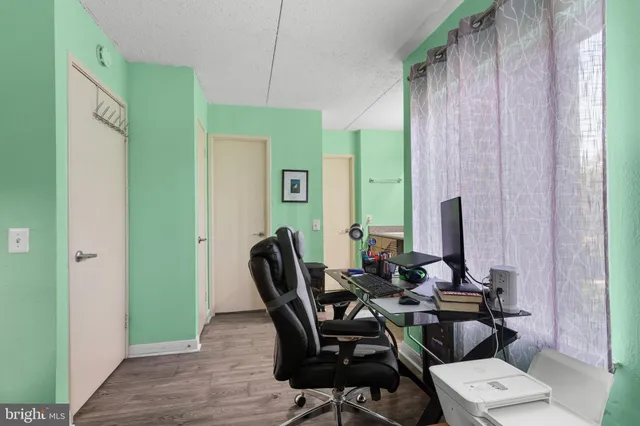 a view of a dining room with furniture and window