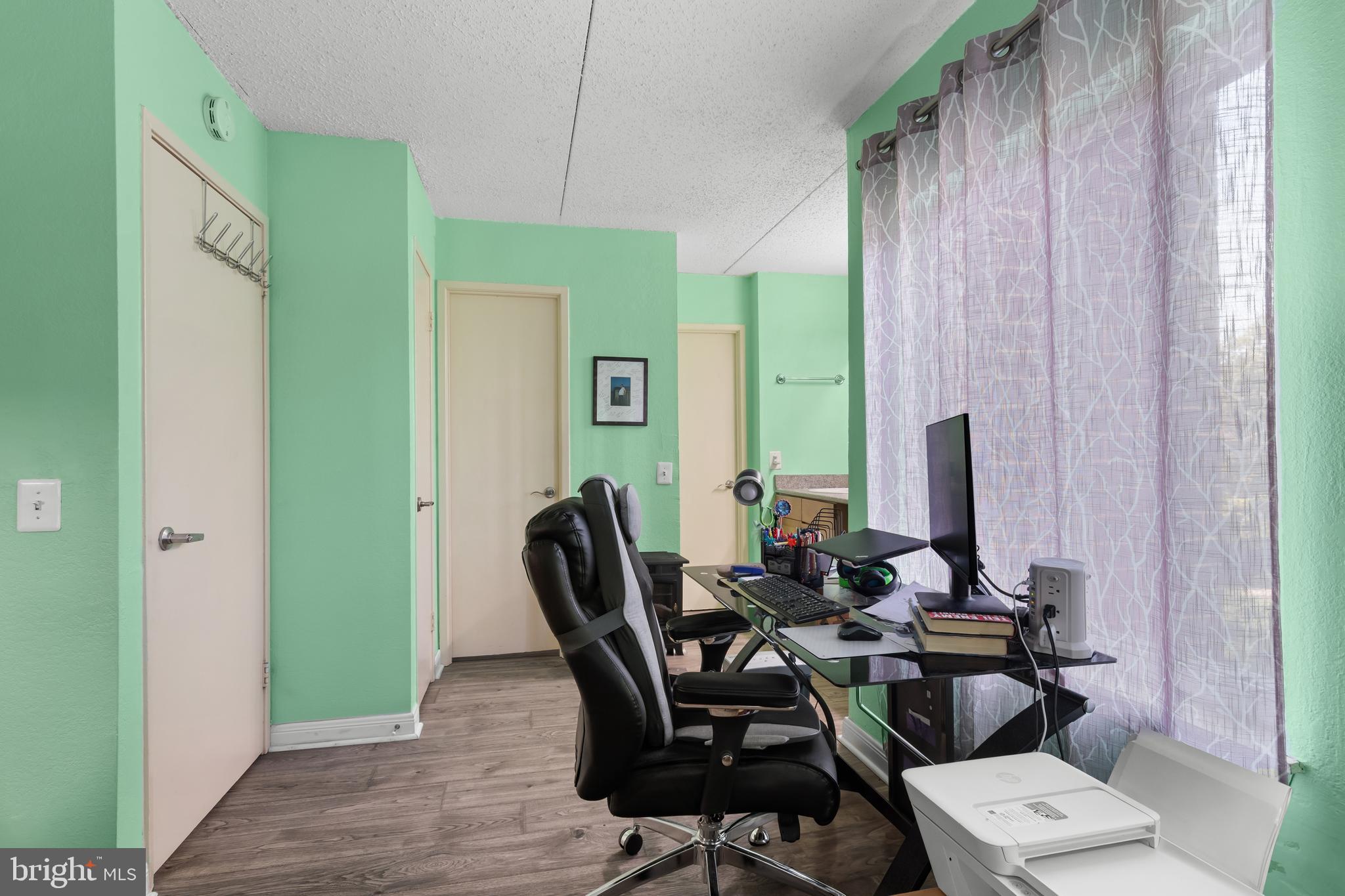 75 South Reynolds Street, Unit 101 Alexandria, VA 22304 - Photo 17 of 42 a view of a dining room with furniture and window