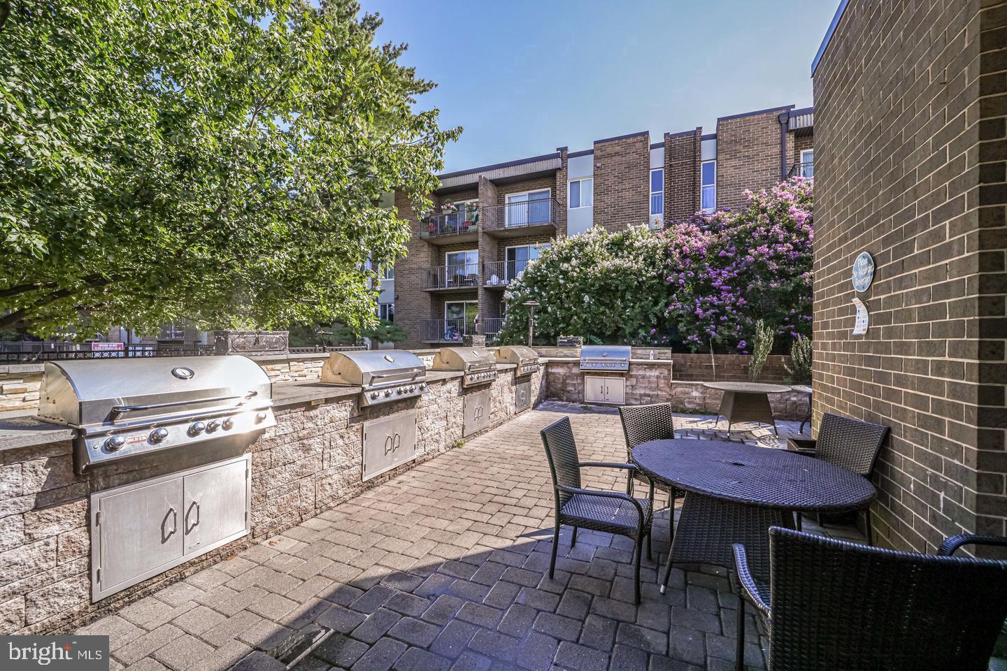75 South Reynolds Street, Unit 101 Alexandria, VA 22304 - Photo 22 of 38 a view of a chairs and table in the terrace