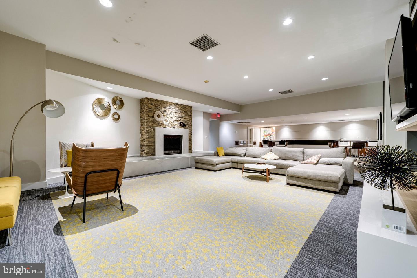 75 South Reynolds Street, Unit 101 Alexandria, VA 22304 - Photo 25 of 42 a living room with furniture and a table