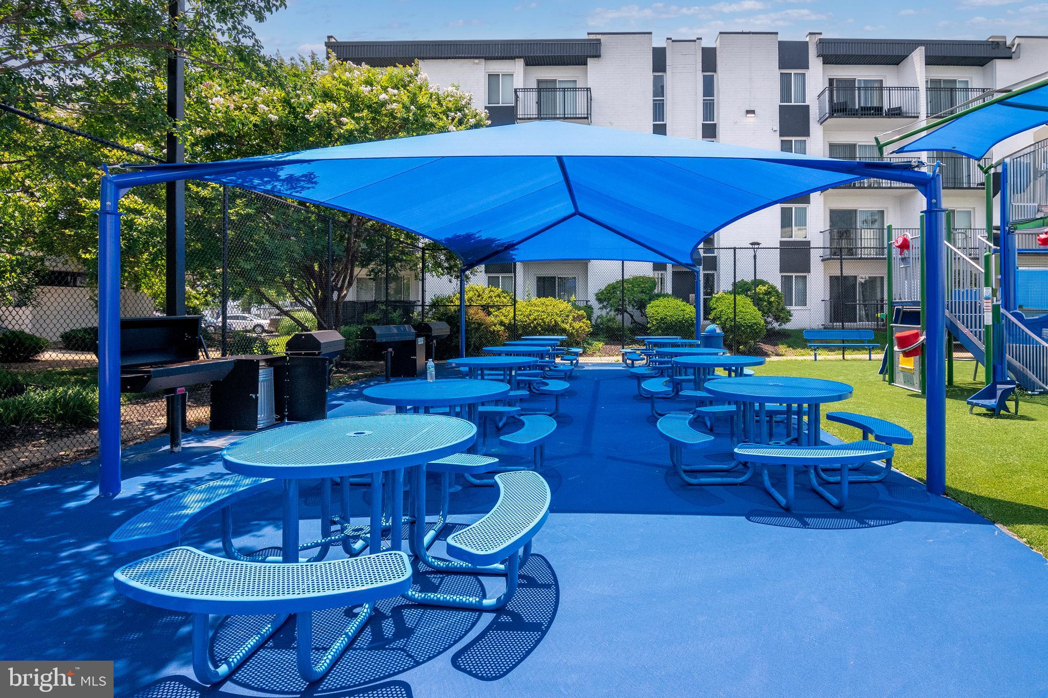 75 South Reynolds Street, Unit 101 Alexandria, VA 22304 - Photo 30 of 42 a view of an outdoor dining space with a patio