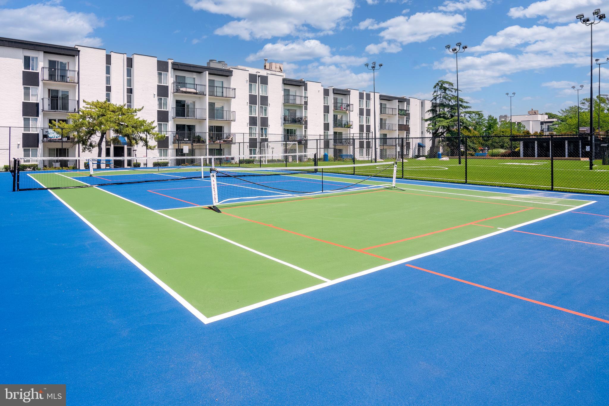 75 South Reynolds Street, Unit 101 Alexandria, VA 22304 - Photo 33 of 42 a view of an outdoor space and basketball court