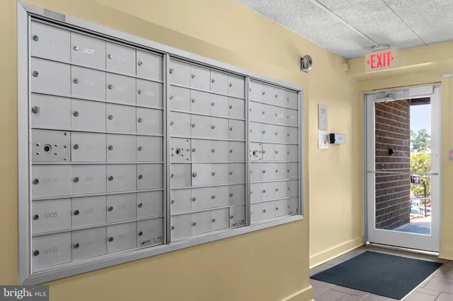 a view of walk in closet with cabinet