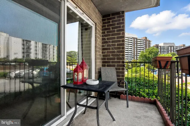 a view of a balcony with chairs