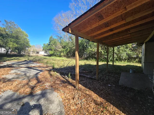 a backyard of a house with lots of green space