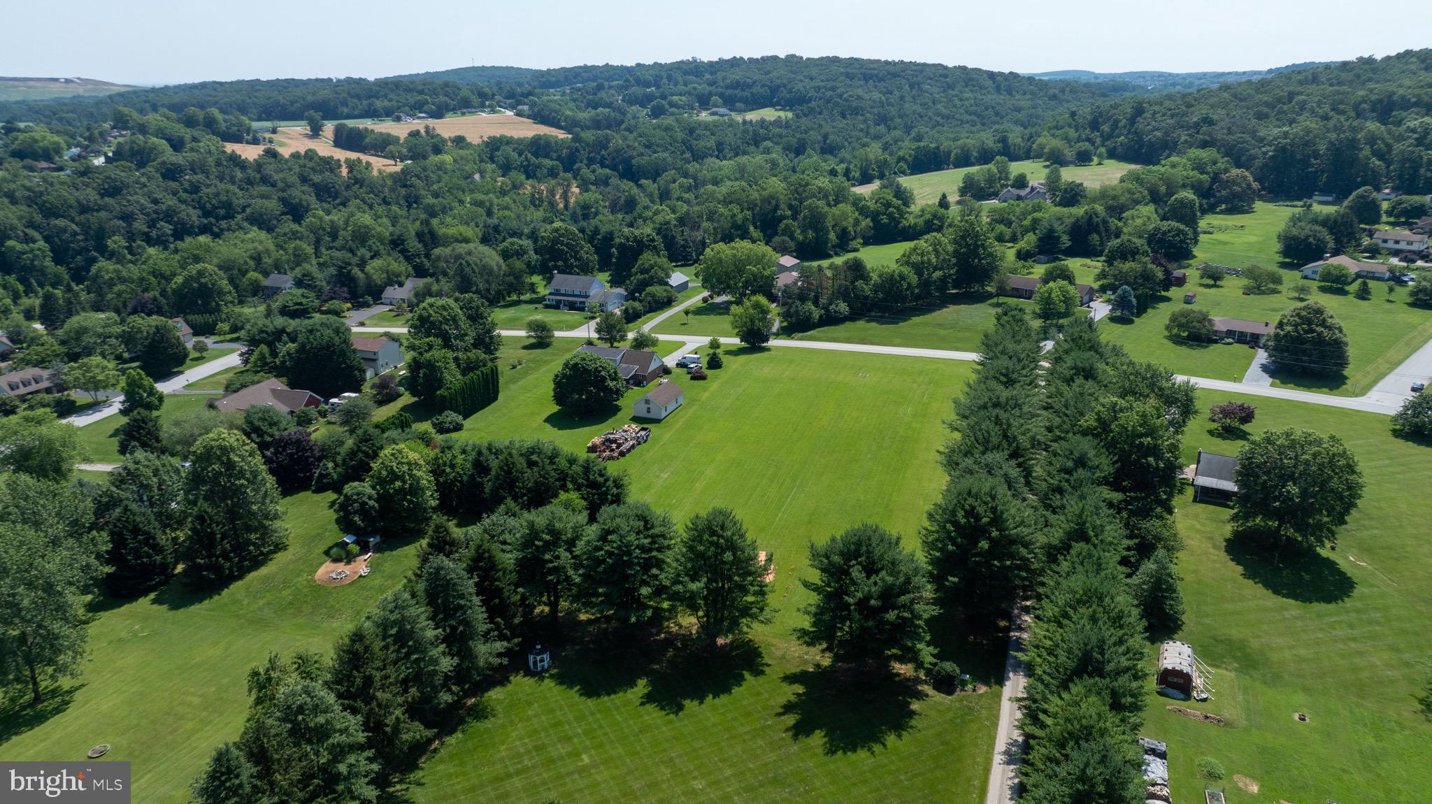 445 Steinfelt Road Red Lion, PA 17356 - Photo 11 of 16 an aerial view of a houses with a lush green hillside