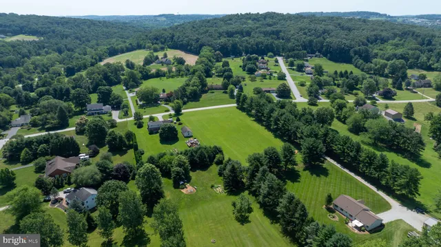 an aerial view of a house with a garden