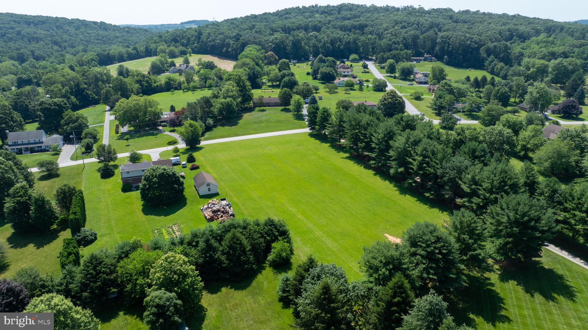 445 Steinfelt Road Red Lion, PA 17356 - Photo 9 of 16 an aerial view of residential houses with outdoor space and trees all around