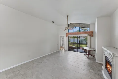 a kitchen with granite countertop stainless steel appliances a sink stove and refrigerator