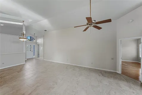 a living room with a fireplace furniture and a rug