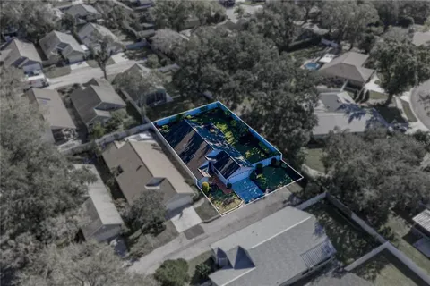 a view of house with garden and tall trees