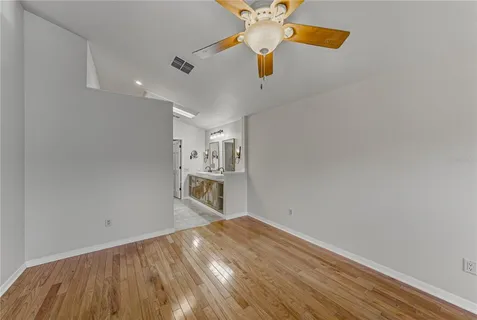 a view of a house with a yard balcony and furniture