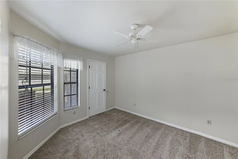 a view of a backyard with plants and a backyard