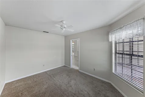 a view of a house with a yard porch and sitting area