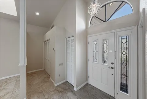 a view of a livingroom with a fireplace and a ceiling fan