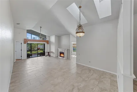 a large kitchen with stainless steel appliances granite countertop a stove a sink and a refrigerator