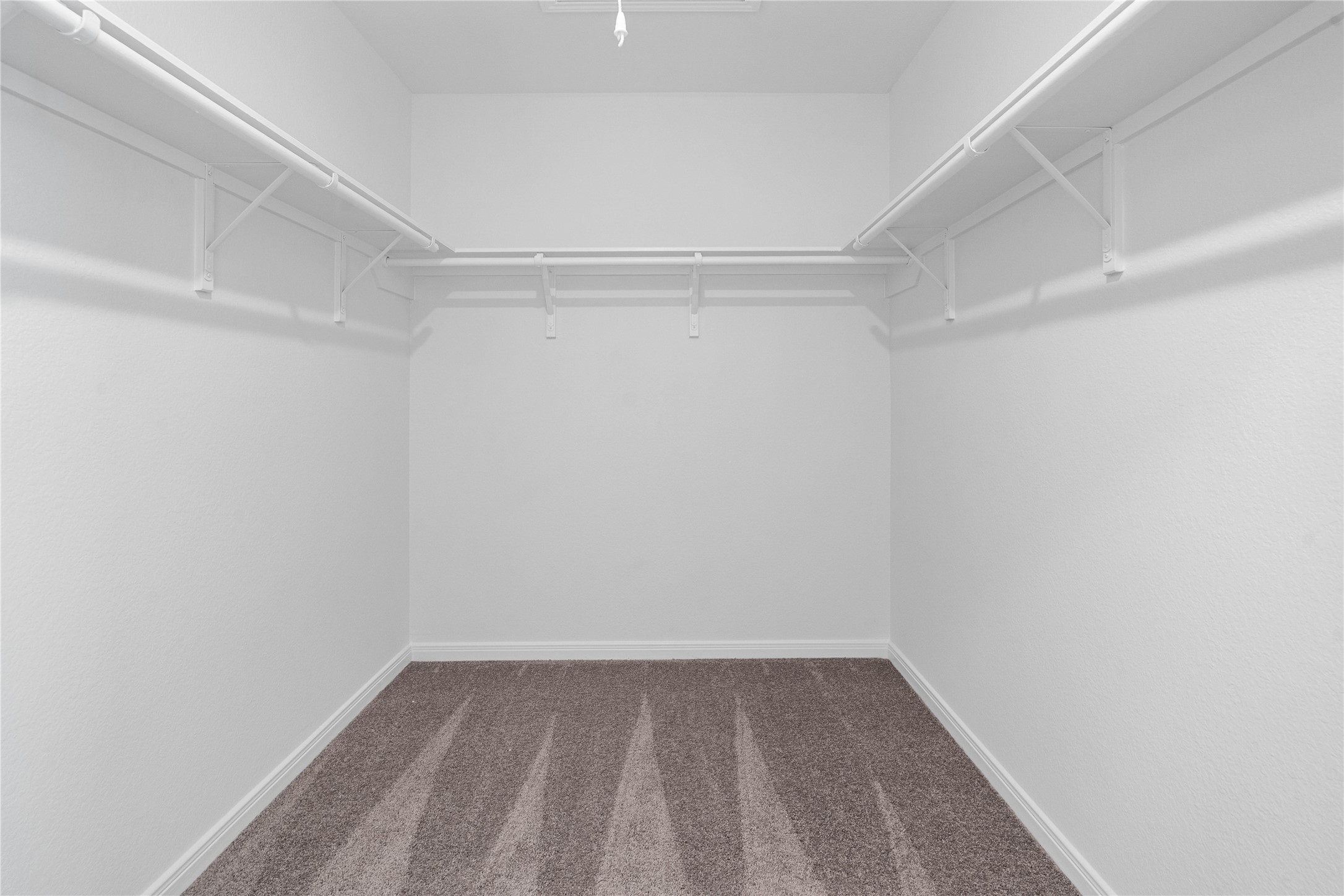25503 Alpine Switchback Drive Spring, TX 77373 - Photo 21 of 32 The primary walk-in closet features high shelving for seasonal storage while keeping your daily essentials within reach.