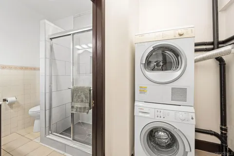 a view of a bathroom with washing machine
