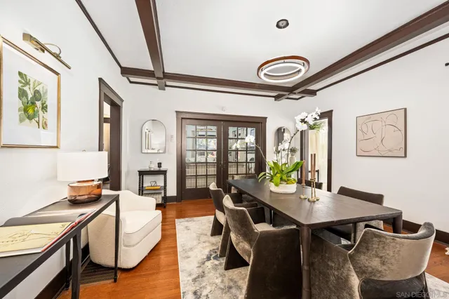 a view of a dining room with furniture and window
