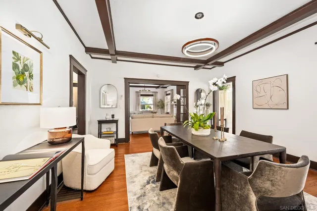a dining room with furniture and window