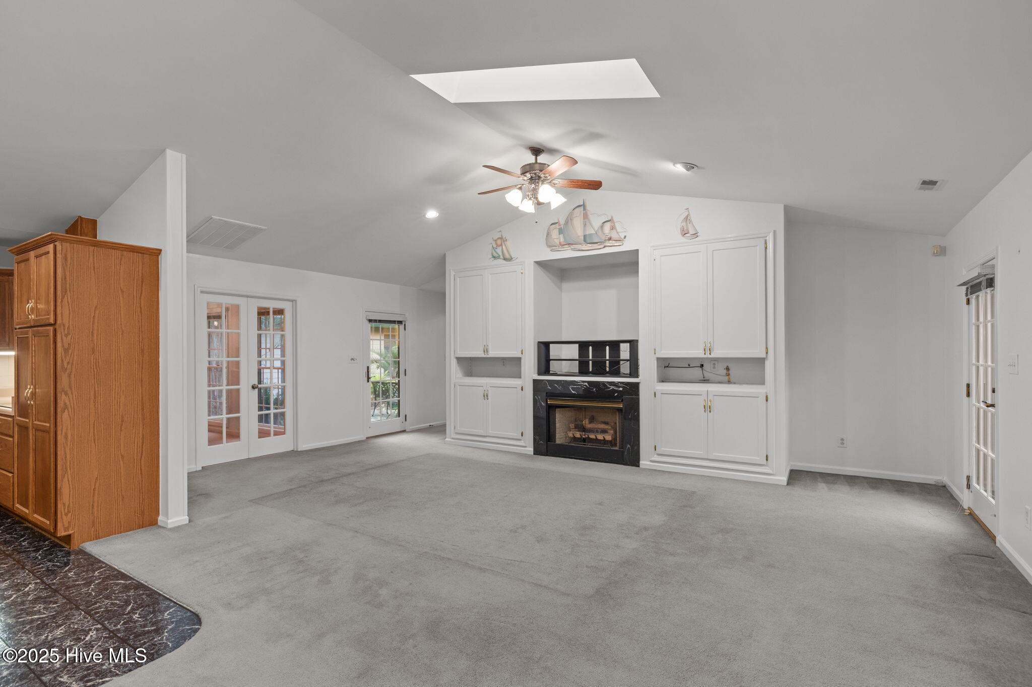 119 White Oak Bluff Road, Unit A Stella, NC 28582 - Photo 24 of 48 Spacious and Open, side hall leads to Primary Suite