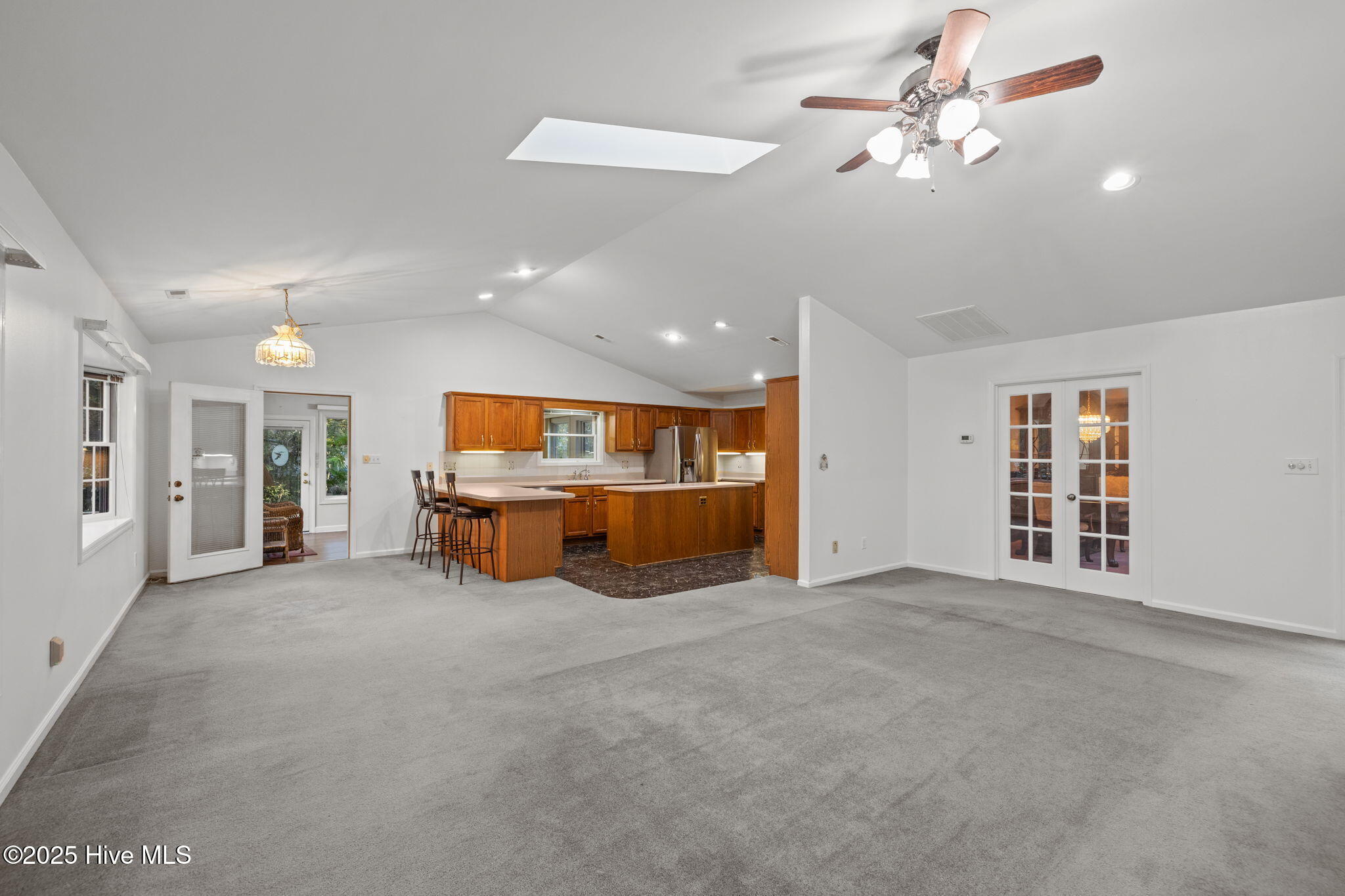 119 White Oak Bluff Road, Unit A Stella, NC 28582 - Photo 25 of 48 Flow to the kitchen and door to the Sunroom