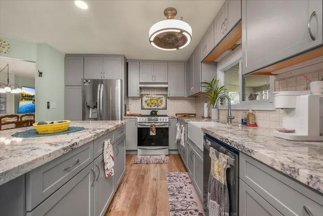 a living room with furniture a rug and a window