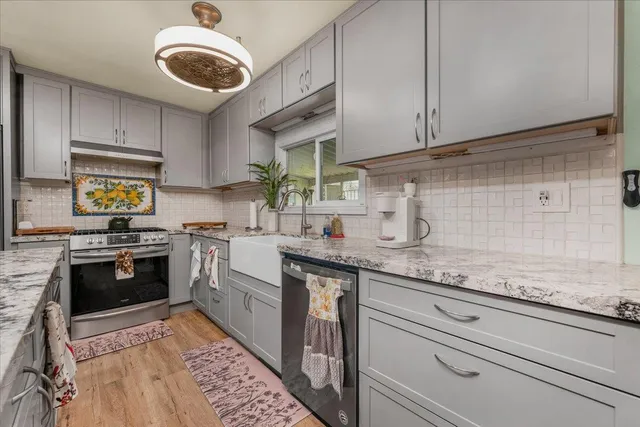 a bed room with a bed and a chandelier